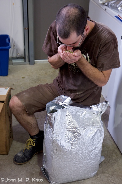 Nate savors the aroma of hops.